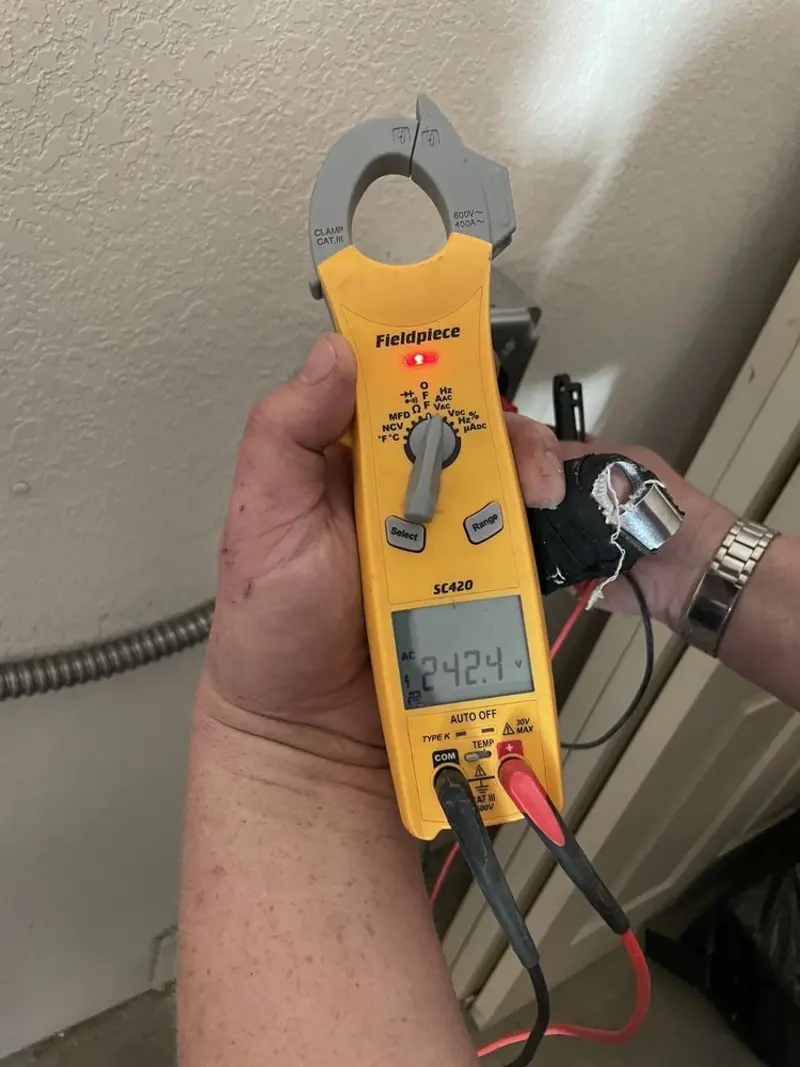 Voltage testing with clamp meter during Generator Installation in Creston